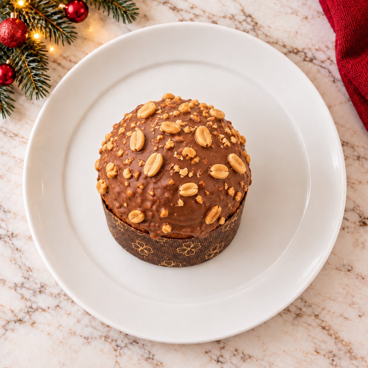 Panettoncino Caramello, Cioccolato e arachidi visto dall’alto, con la copertura in primo piano.